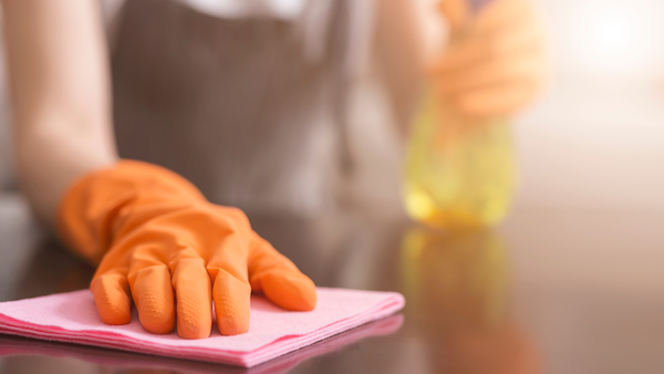 Disinfecting surfaces in a food tech workshop